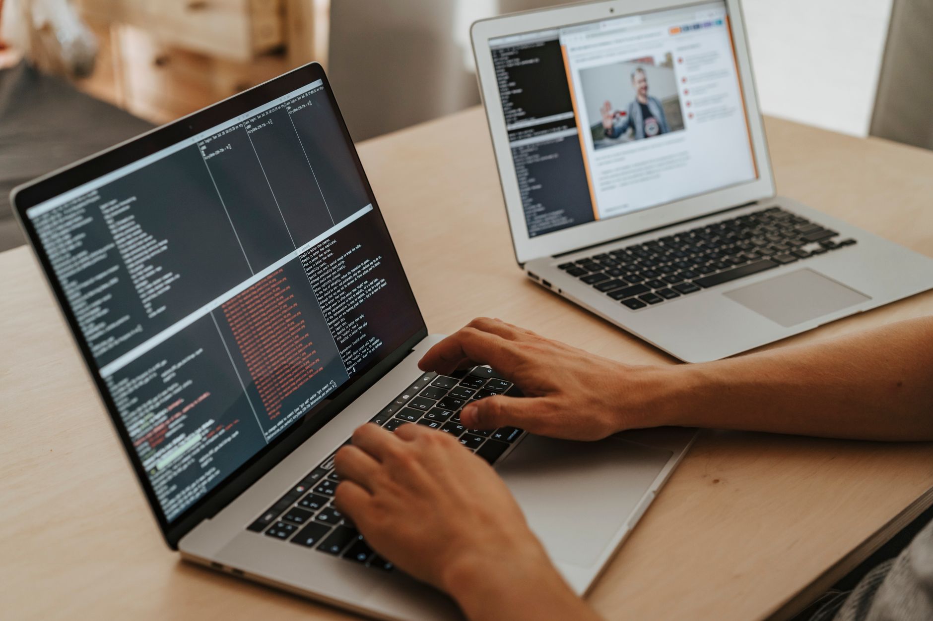 Developer working on a laptop, representing open-source tool adoption