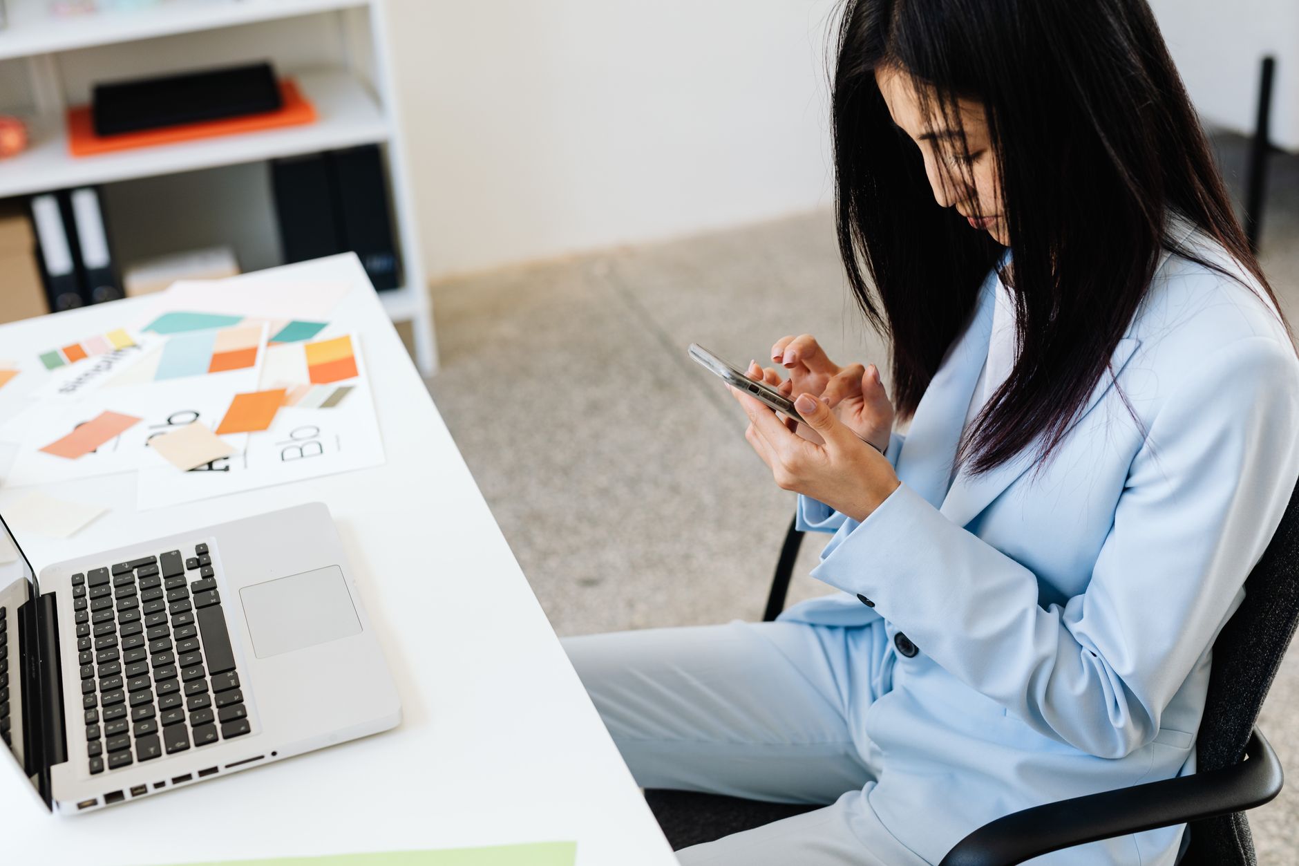 Professional using a smartphone for business calls, representing the openphone Quo virtual phone system