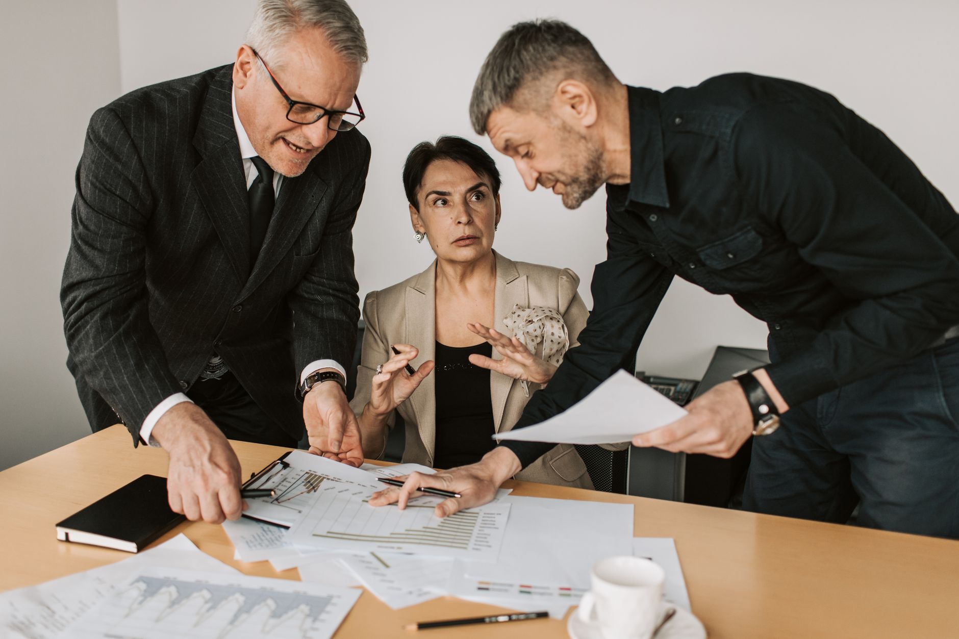 Small business team weighing the pros and cons of a new phone system