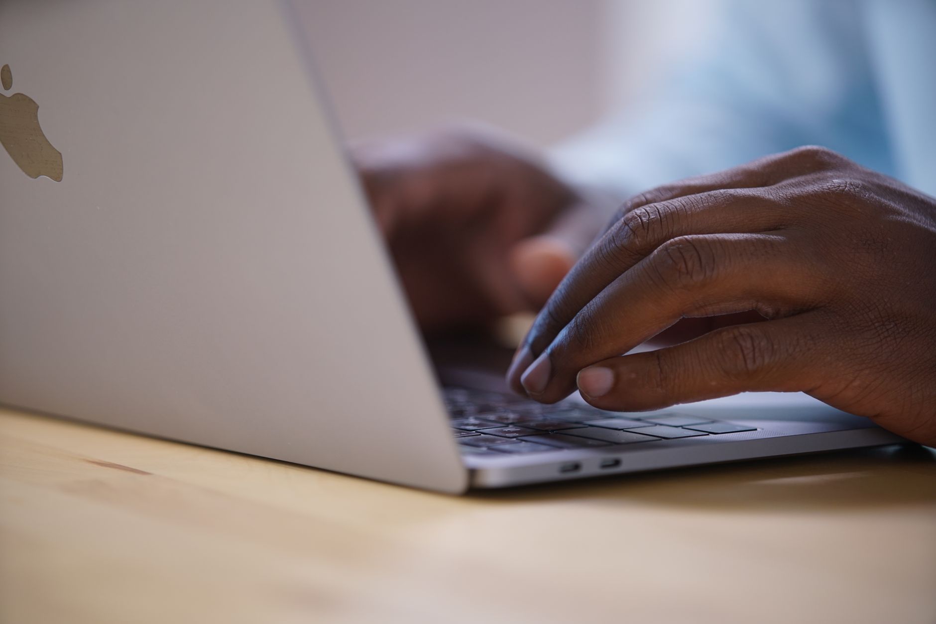 Person searching Google on a laptop, illustrating why AI Overviews cannot be fully disabled